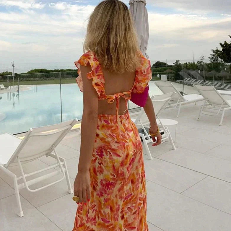 Esmira | Dames oranje zomerjurk – lichte midi zonnejurk