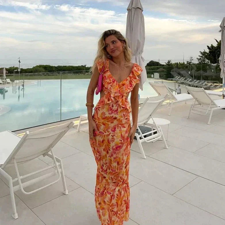 Esmira | Dames oranje zomerjurk – lichte midi zonnejurk