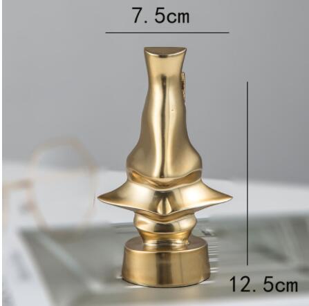 Optigold | Gouden metalen neus- en bril sculptuur – Moderne decoratieve kunst voor thuis en op kantoor