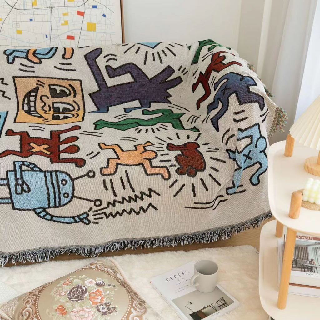 PuzzleCuddle | Geanimeerde throw deken met kwastjes en opdruk van legpuzzel